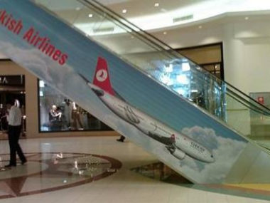 escalator with turkish airlines logo on side