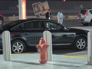 car parked behind hydrant