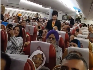 a bunch of people in airline cabin