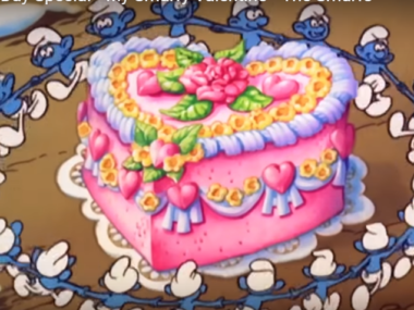 smurfs walking around cake