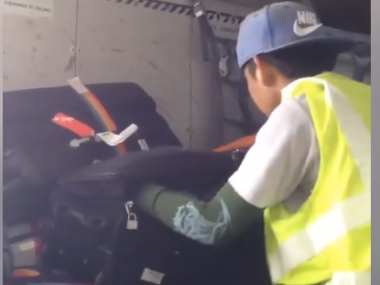 Baggage Handler Plays Luggage Toss Out the Side of an Alaska Airlines Jet