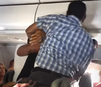 flight attendant and passenger fighting