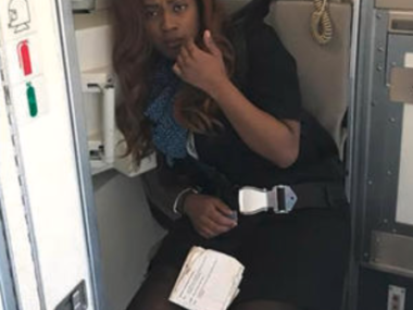 flight attendant making announcement