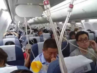 people using air masks on plane