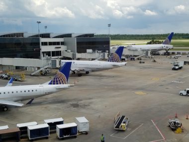 airplanes docked on tarmac