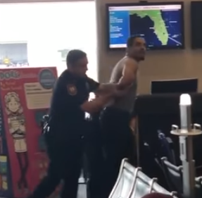 man being arrested in airport