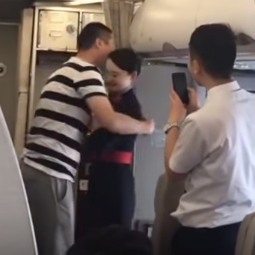 flight attendant being hugged by fiance