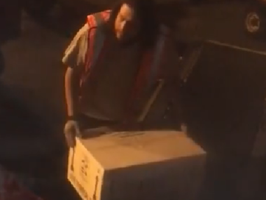 baggage handler holding box