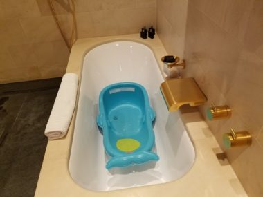 hotel bathtub with baby bath
