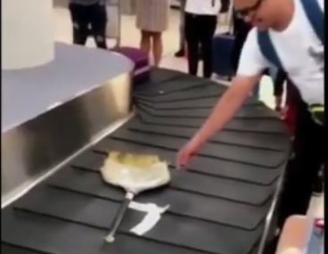 broom on baggage carousel