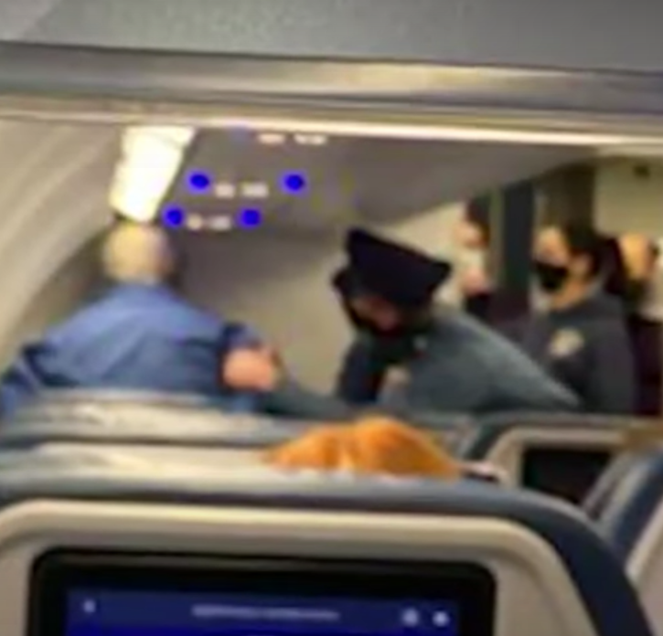 Passenger Hits First Class Flight Attendant, Tries To Open Cabin Door