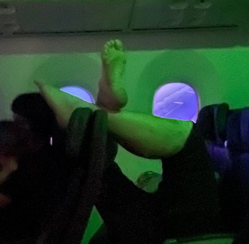 With Passenger's Bare Feet In The Air, American Airlines Says "Everyone's Trying..