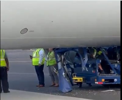 Watch: Tug Get Stuck Underneath An American Airlines Boeing 737 At LaGuardia Air..