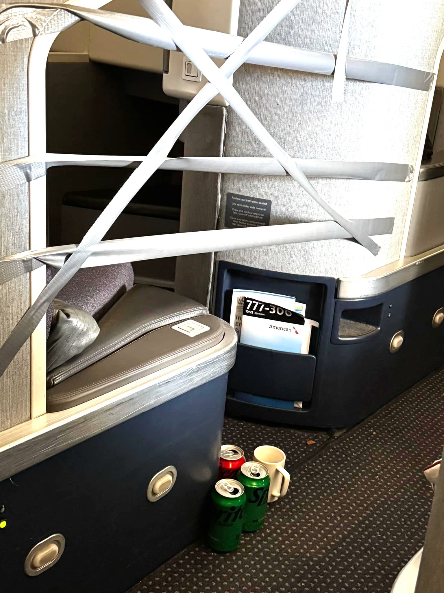 American Airlines Flight Attendant Deploys Duct Tape Barrier To Stop Business Class Passenger’s Trash Tossing