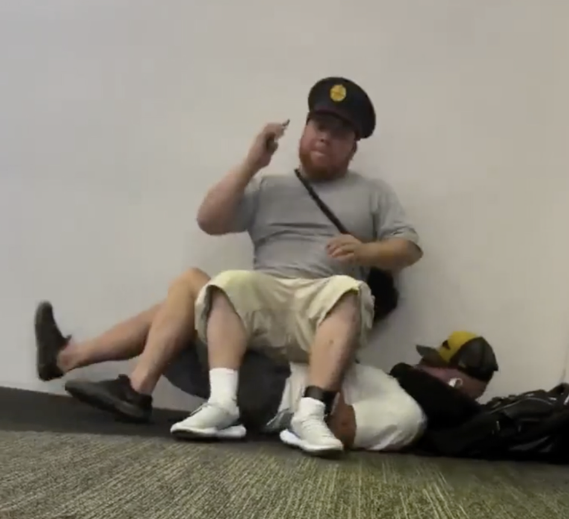 Passenger Uses A Resting Traveler As A Chair At San Francisco Airport – Video Shows The Man Kicking Him Off [Roundup]