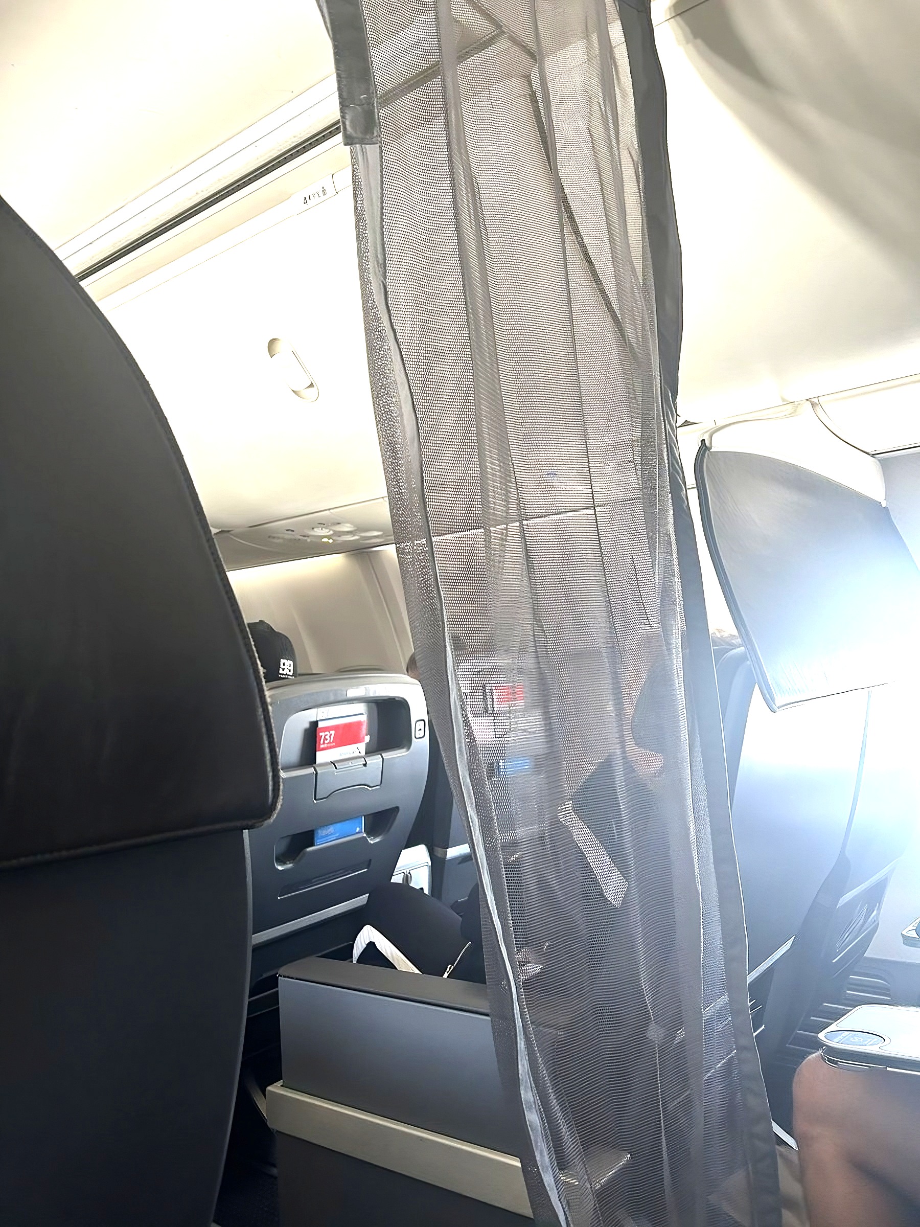 Why Airlines Quietly Switched To See-Through Curtains Between First Class And Coach—It’s Worth Millions