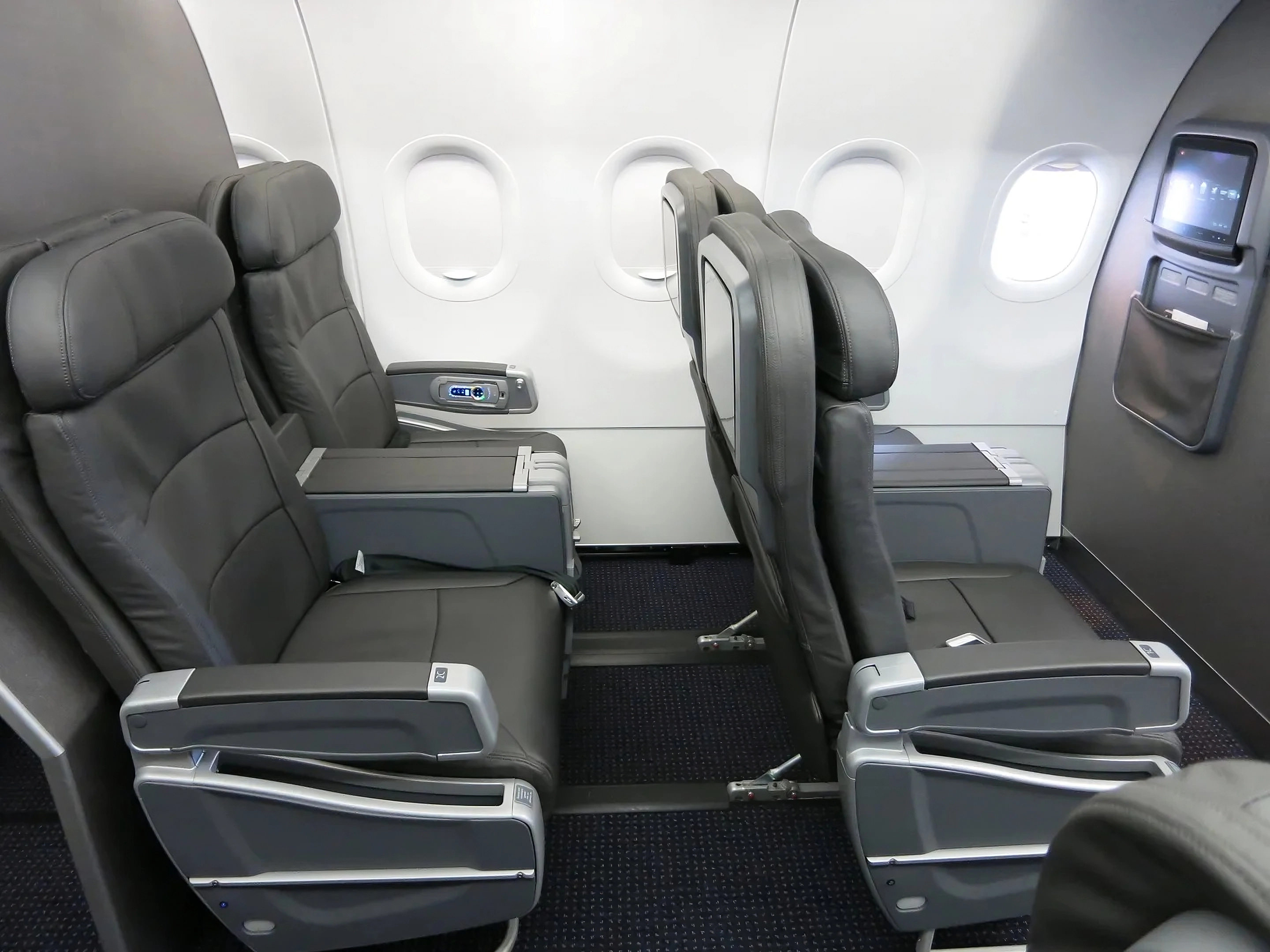 American Airlines Will Add Extra First Class Seats Starting This Fall—And Remove The Last Seatback TVs